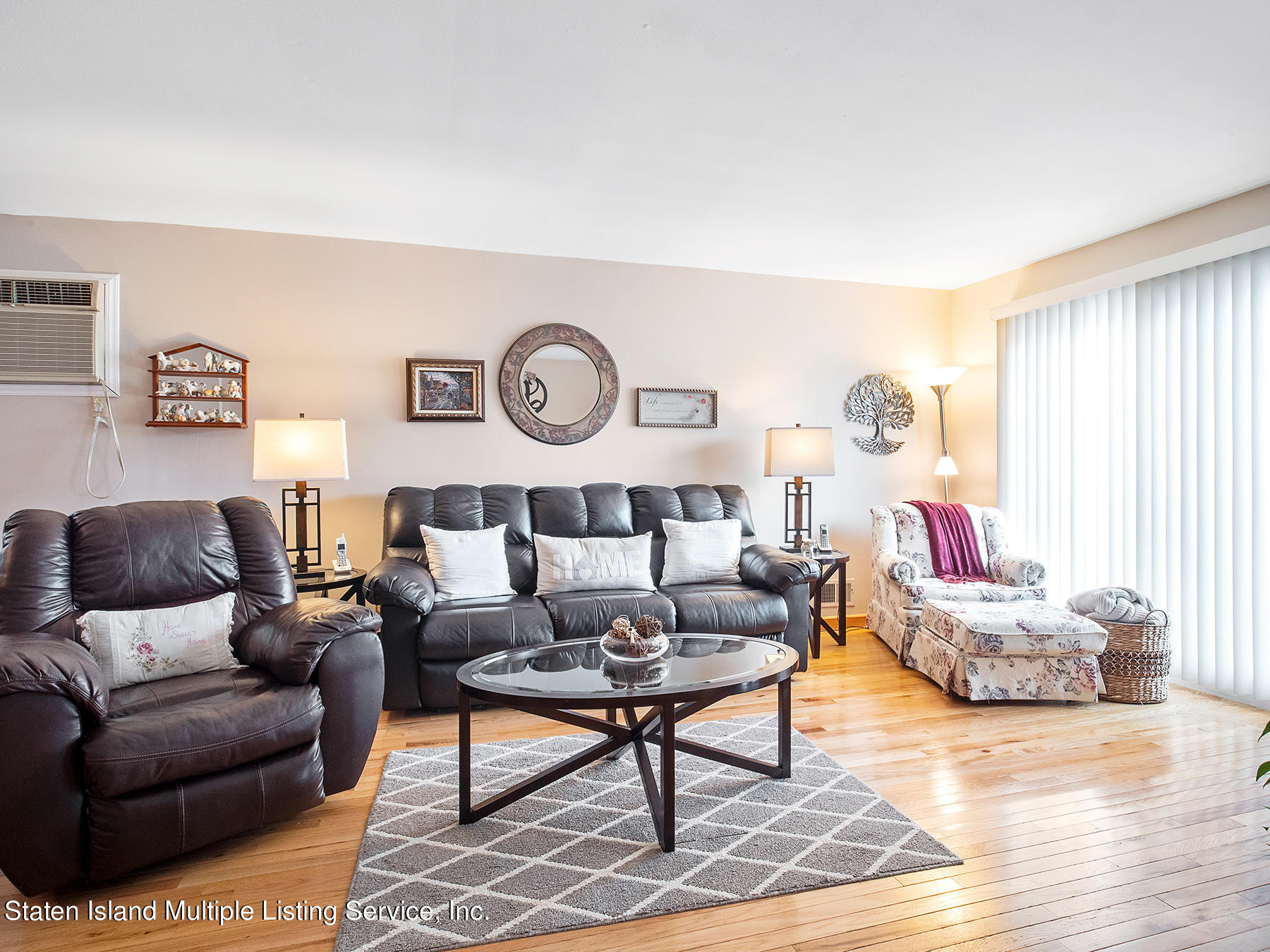 84 Stack Drive Staten Island, NY 10312 - Photo 6 of 29 a living room with furniture and wooden floor