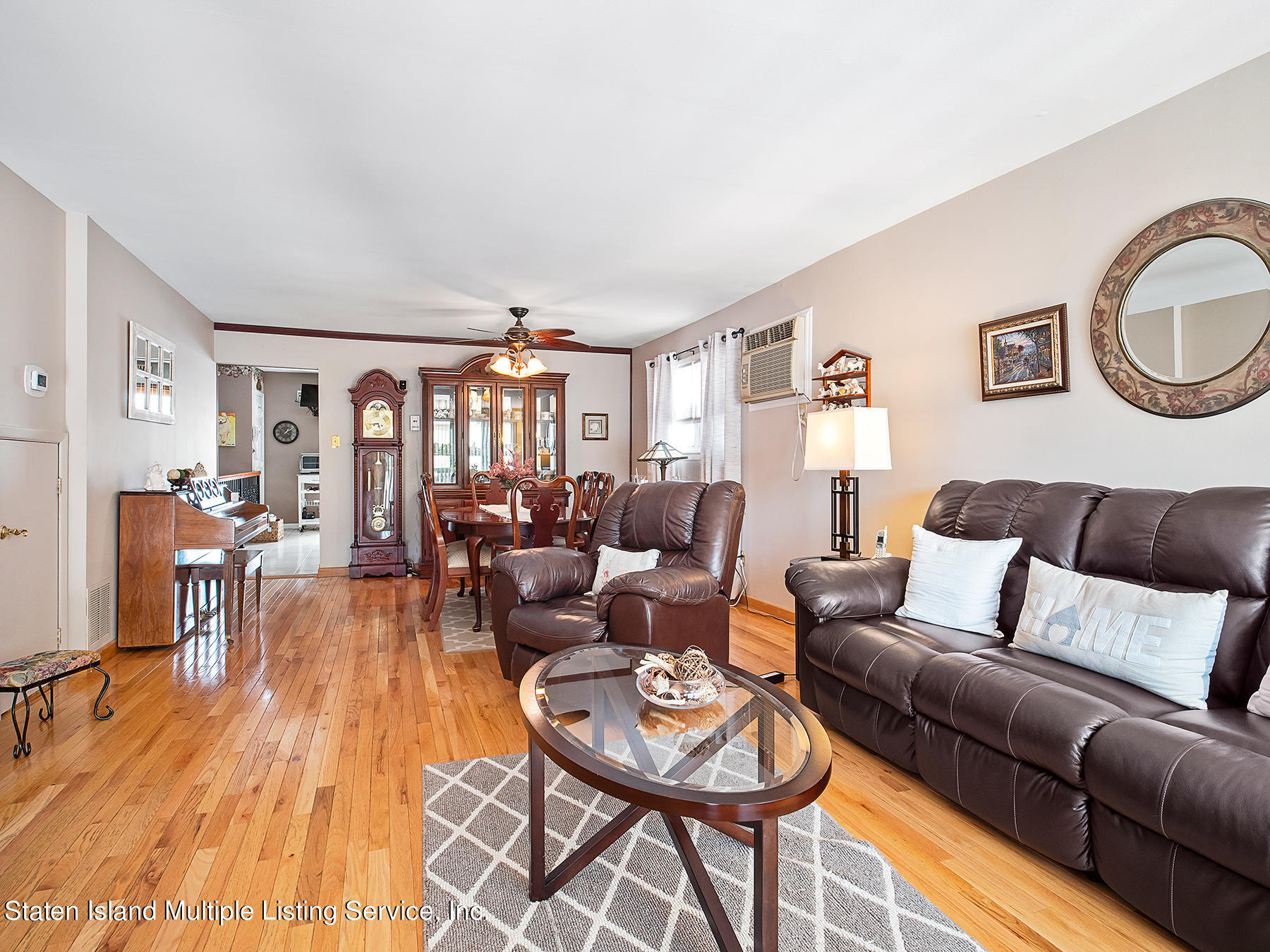 84 Stack Drive Staten Island, NY 10312 - Photo 7 of 29 a living room with furniture and wooden floor