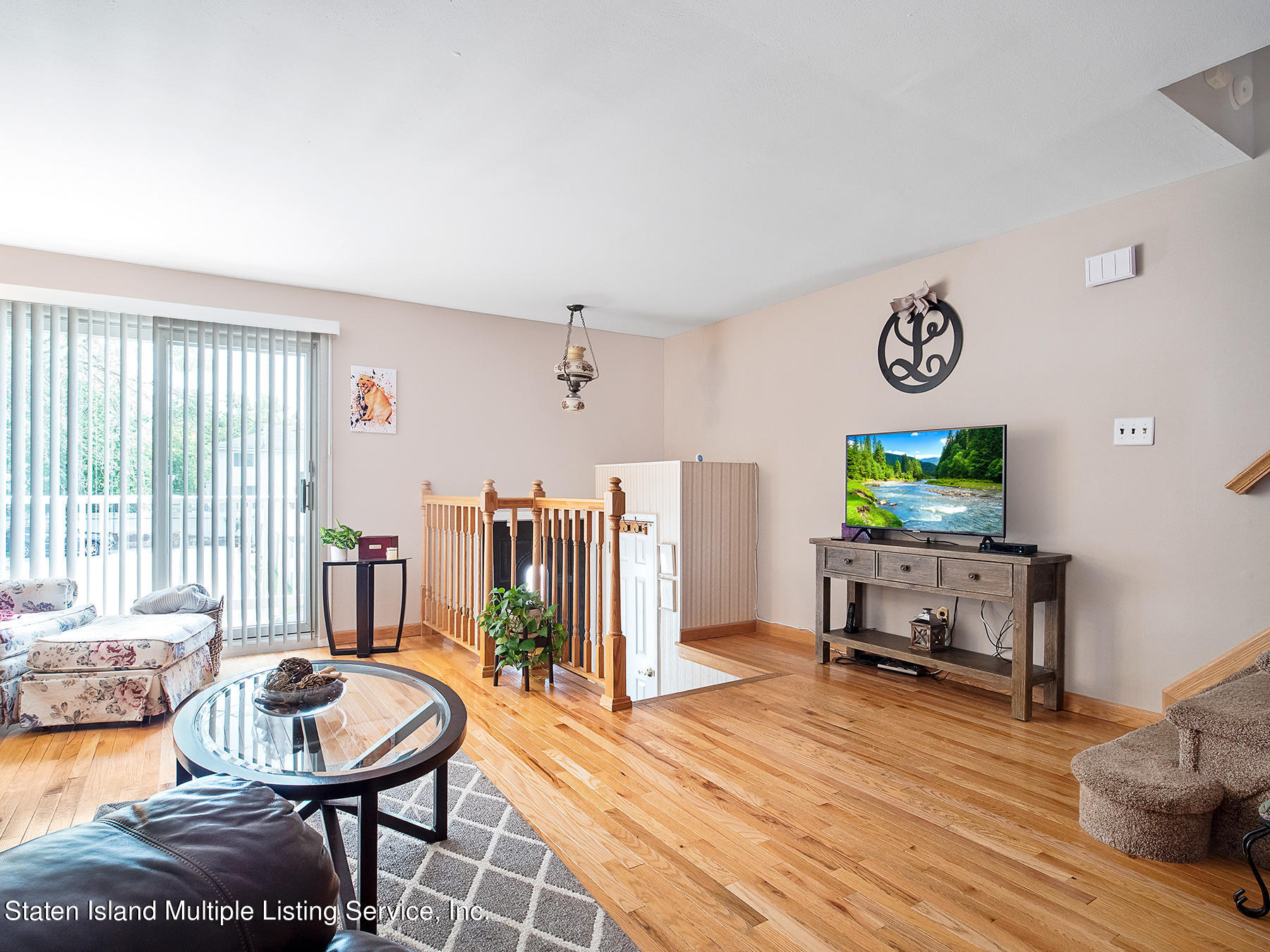 84 Stack Drive Staten Island, NY 10312 - Photo 8 of 29 a living room with furniture and a flat screen tv