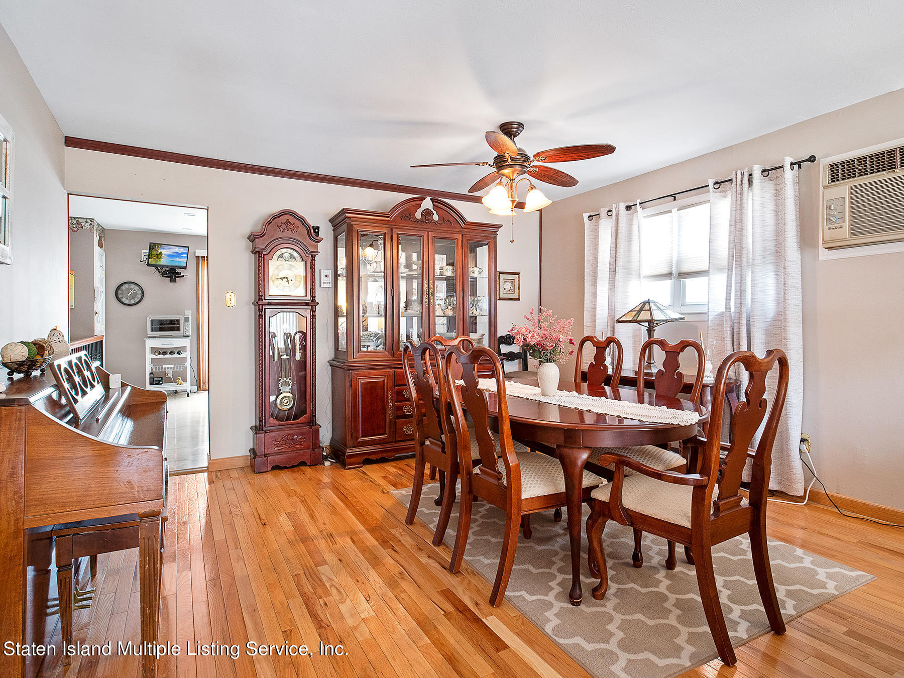 84 Stack Drive Staten Island, NY 10312 - Photo 9 of 29 a view of a a dining room with furniture window and wooden floor