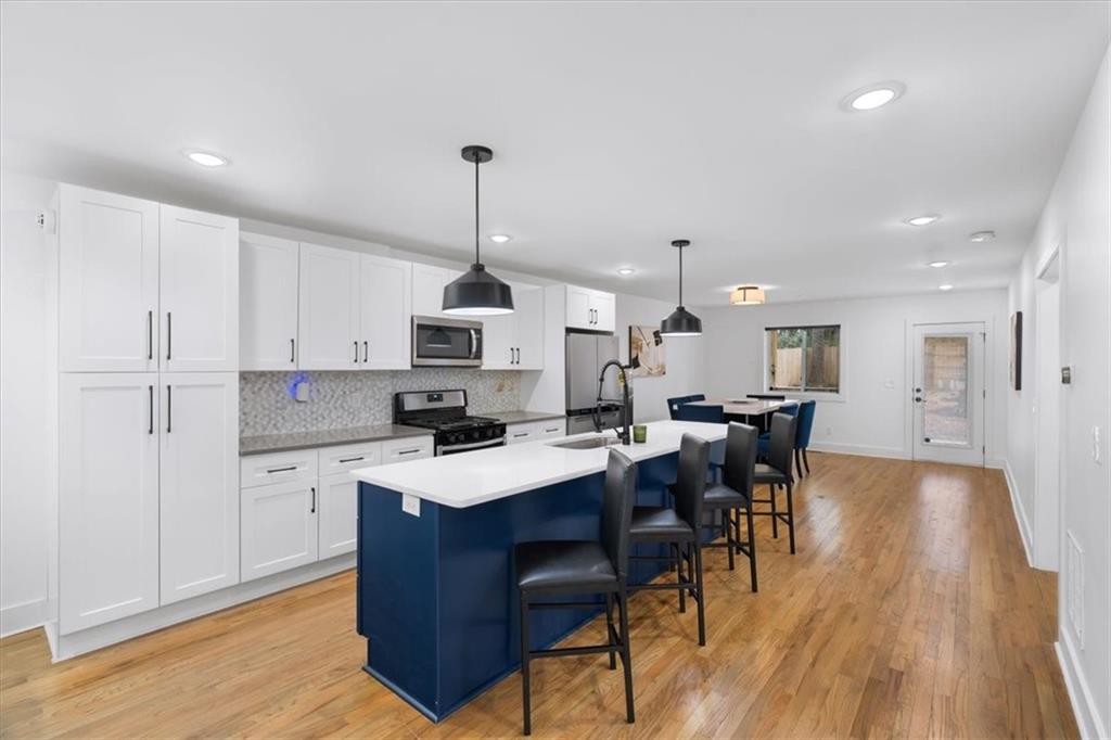 1846 Rogers Avenue Southwest Atlanta, GA 30310 - Photo 2 of 46 a view of kitchen with cabinets counter top space and stainless steel appliances