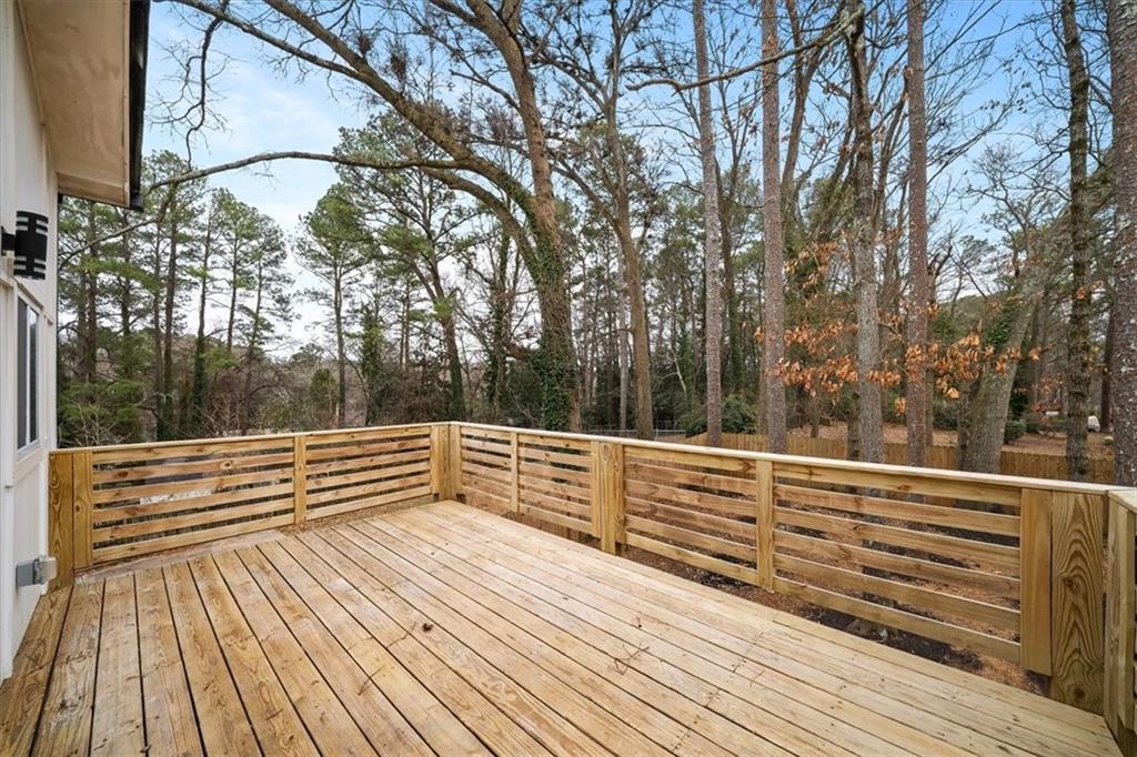 1846 Rogers Avenue Southwest Atlanta, GA 30310 - Photo 23 of 46 a view of a roof deck with couches and wooden floor