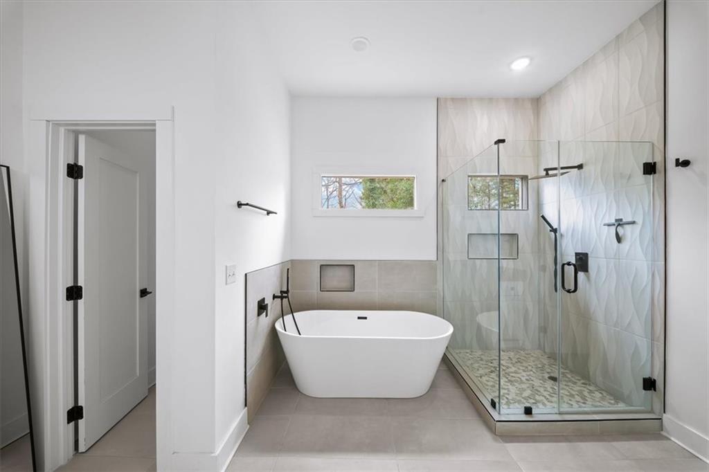 1846 Rogers Avenue Southwest Atlanta, GA 30310 - Photo 24 of 46 a bathroom with a bathtub and shower