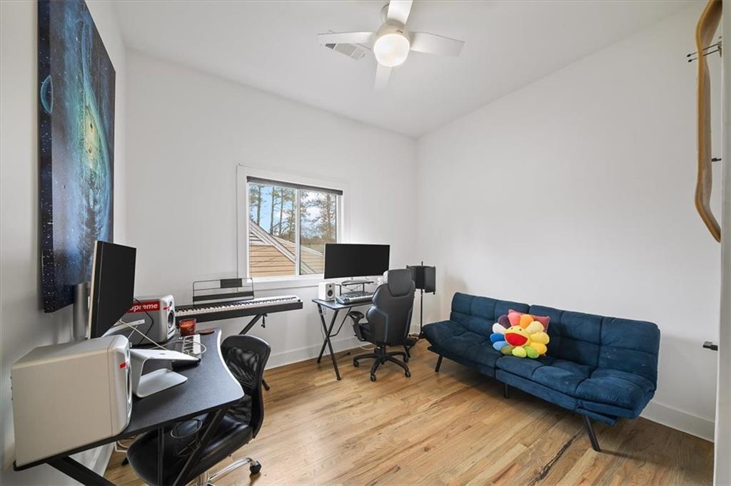1846 Rogers Avenue Southwest Atlanta, GA 30310 - Photo 28 of 46 a work room with furniture and a flat screen tv