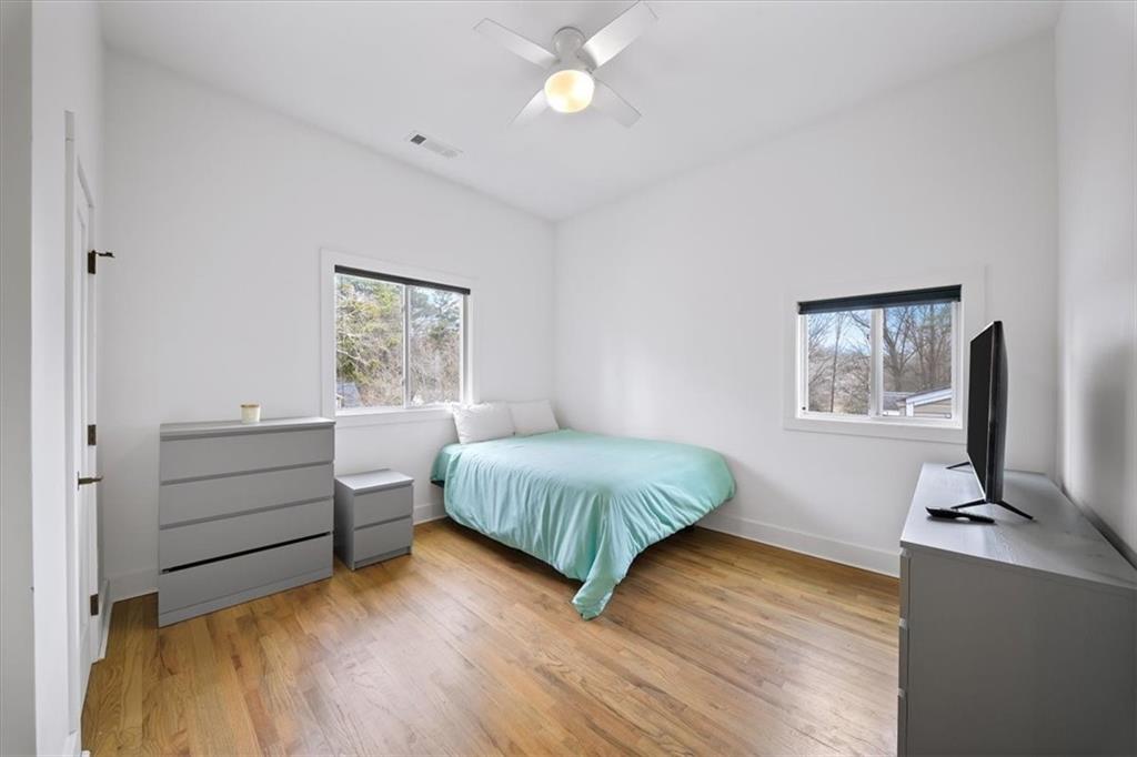1846 Rogers Avenue Southwest Atlanta, GA 30310 - Photo 31 of 46 a bedroom with a bed and a window