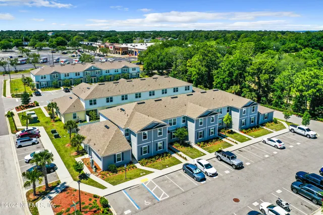 an aerial view of a house with a garden