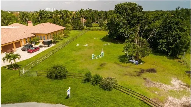 a view of a swimming pool with a yard