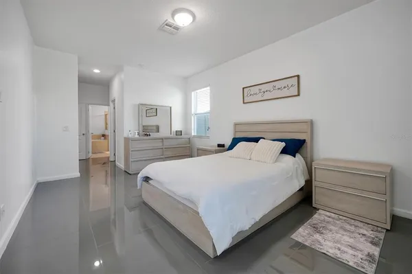 a bedroom with a bed and closet