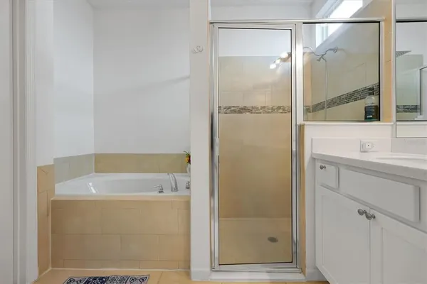 a bathroom with a shower and a sink