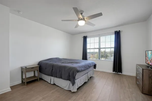 a bed room with a bed and a window