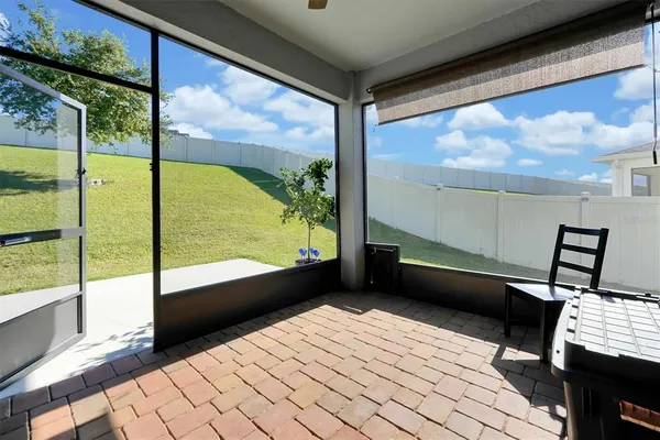 a view of a porch with furniture