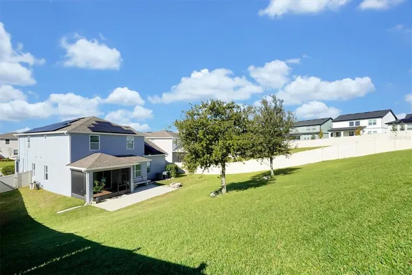 a view of a house with a big yard