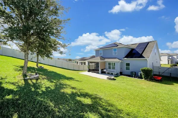 a view of a house with a big yard