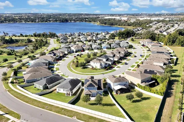 a view of a swimming pool with a yard