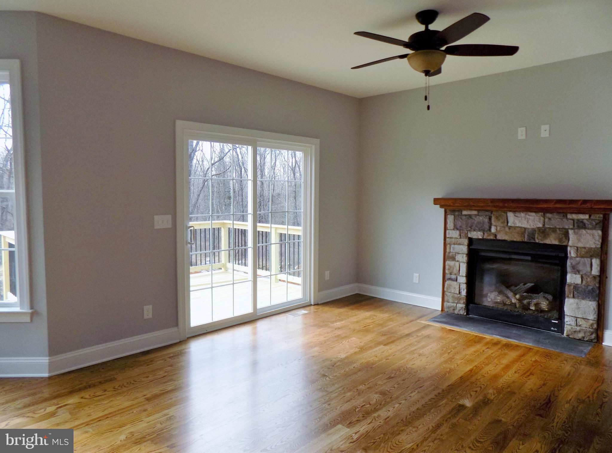 785 Pyletown Road Boyce, VA 22620 - Photo 12 of 30 Family Room W/ F.P. & Custom Hardwoods