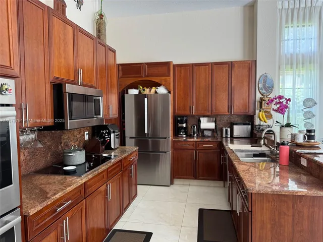 a bedroom with a bed and a potted plant