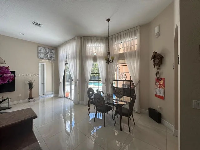 a bathroom with a sink vanity mirror and toilet