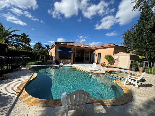 a view of a swimming pool with a patio