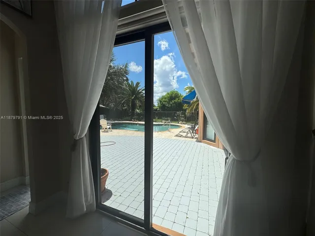 a bathroom with a sink a toilet a mirror and shower