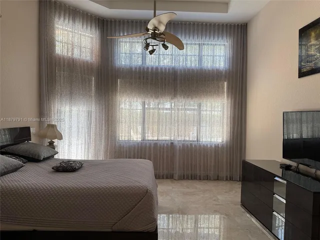 a bedroom with a bed and a closet