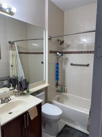 a view of a house with swimming pool and sitting area