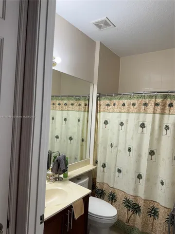 a view of a swimming pool with a yard