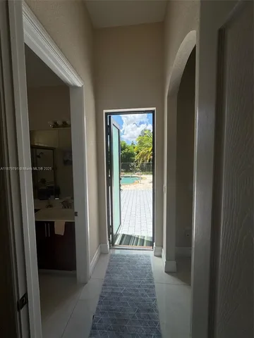 a view of a swimming pool with a yard