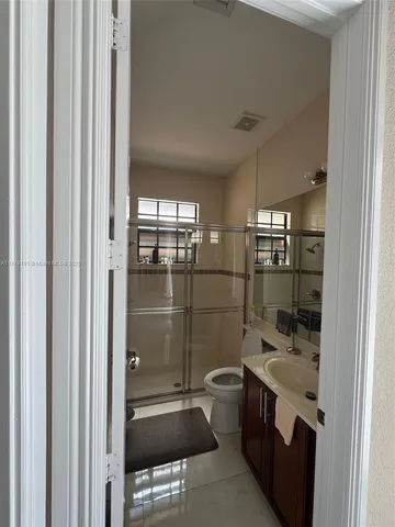 a view of backyard and bathroom