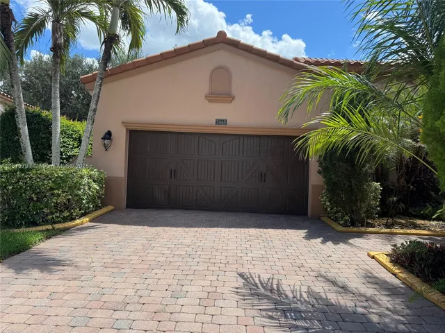a view of a garden with lawn chairs