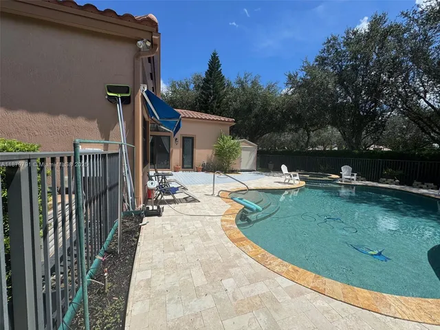 a view of a street with palm trees
