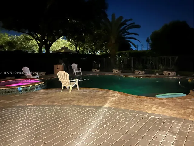 a view of a sink a window and a potted plant