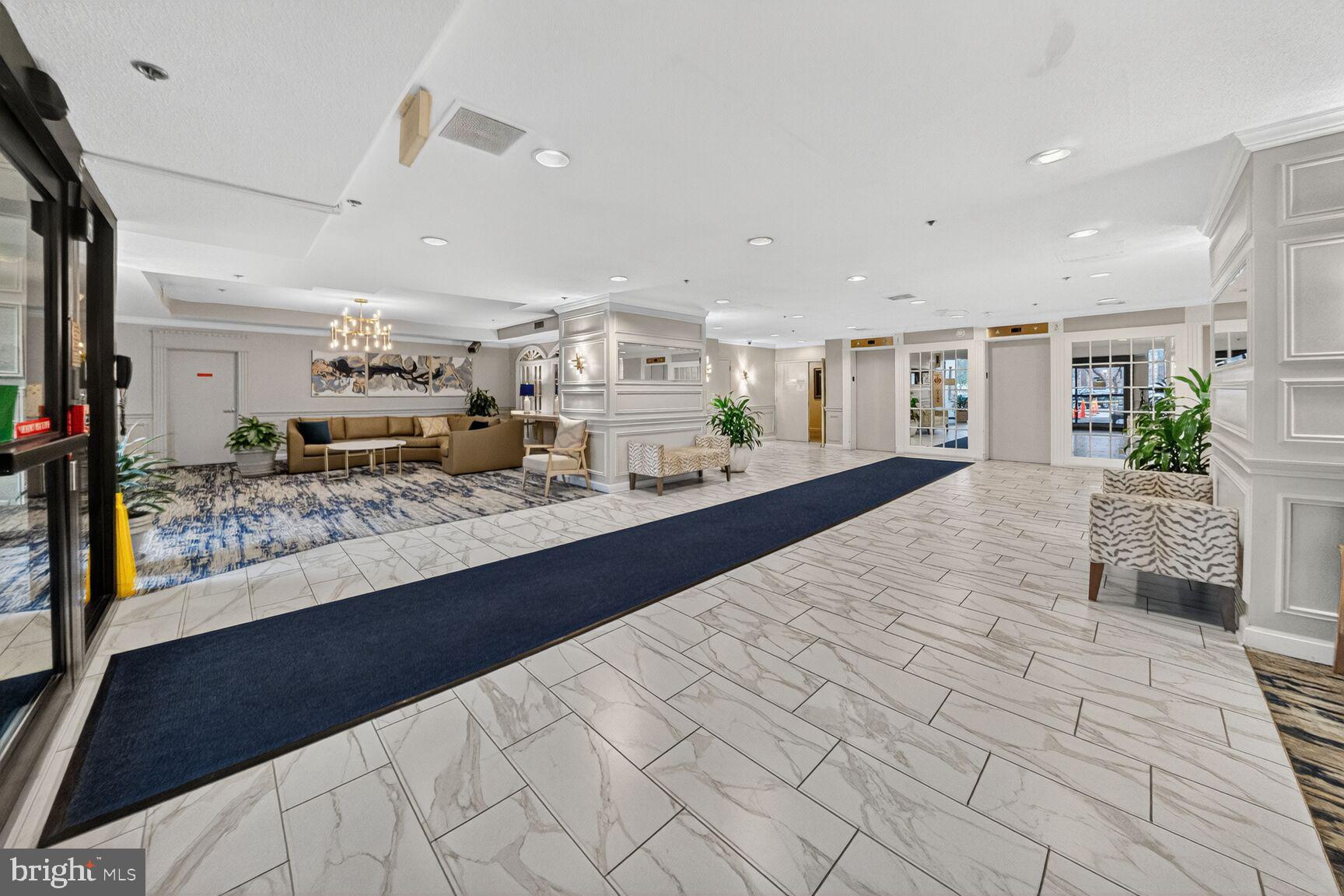 15107 Interlachen Drive, Unit 21025 Silver Spring, MD 20906 - Photo 24 of 38 a large white kitchen with a large window