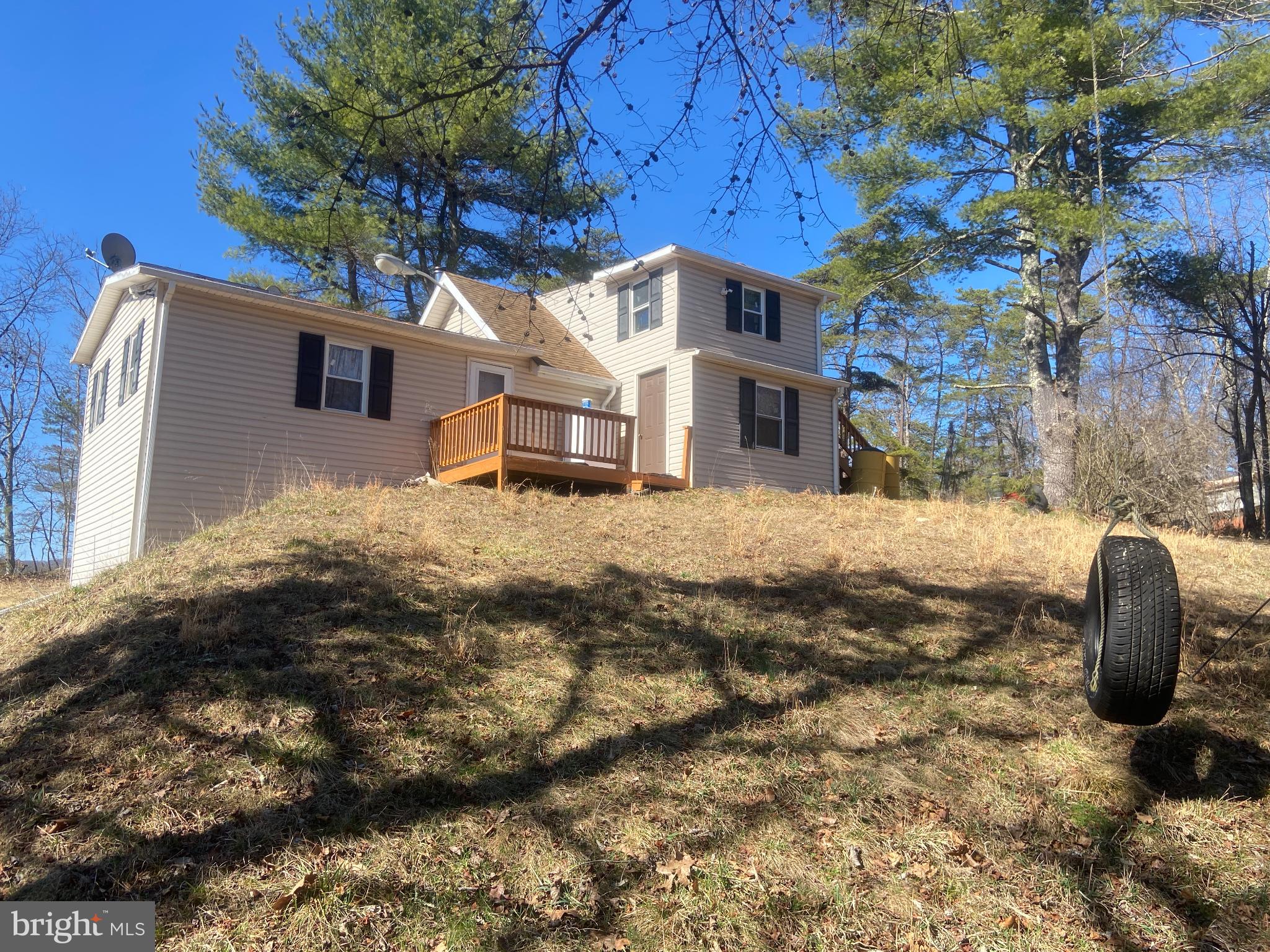 31207 Gold Plains Road Southeast Little Orleans, MD 21766 - Photo 12 of 96 a backyard of a house with large trees