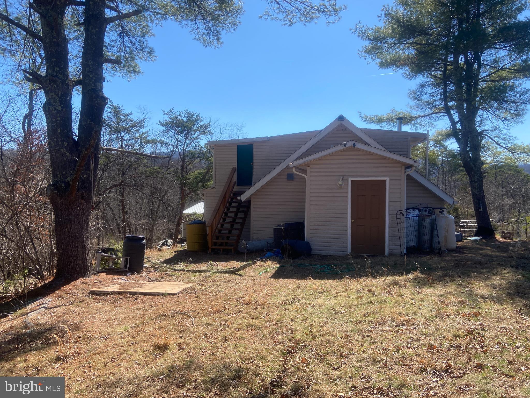 31207 Gold Plains Road Southeast Little Orleans, MD 21766 - Photo 63 of 96 a view of a house with a yard covered in snow