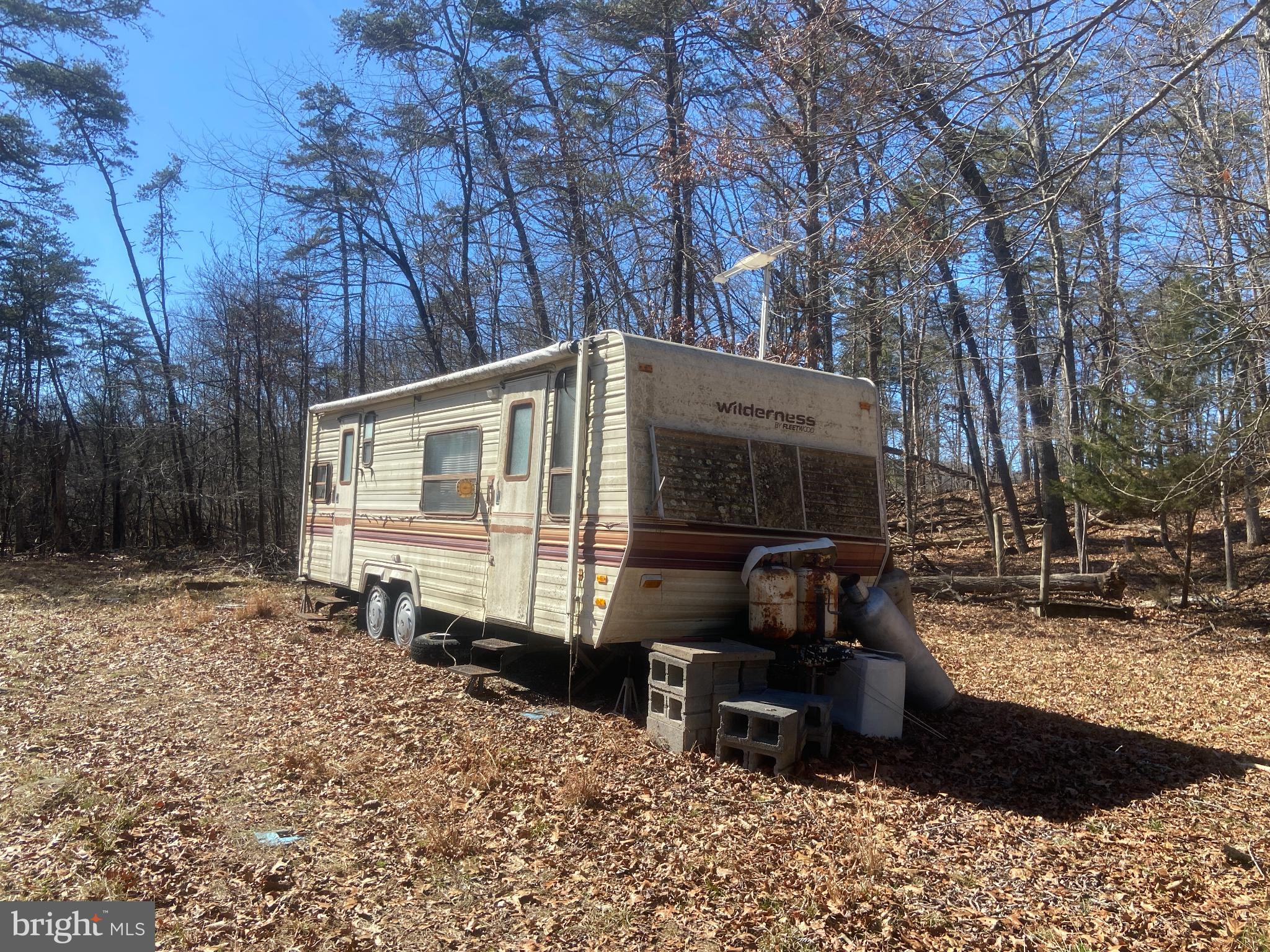 31207 Gold Plains Road Southeast Little Orleans, MD 21766 - Photo 67 of 96 a view of a house with a yard covered in snow