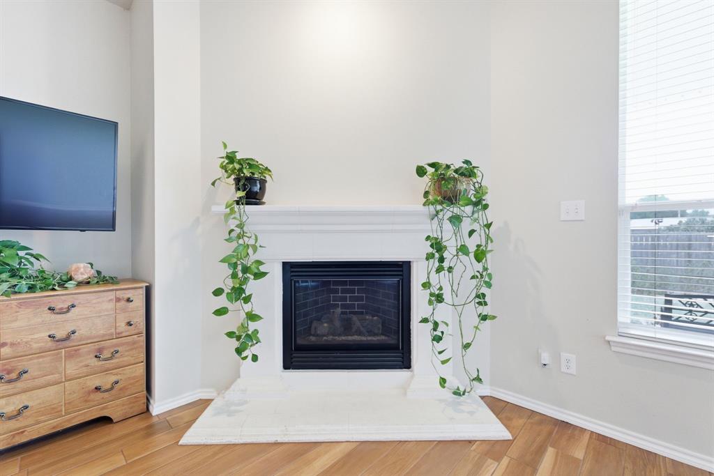 817 Huebner Way Burleson, TX 76028 - Photo 21 of 35 Enjoy a cozy fireplace when those winter nights are a little colder.
