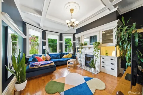 a living room with furniture fireplace and a chandelier