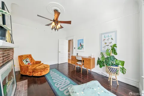 a bedroom with a bed and a large window with outer view