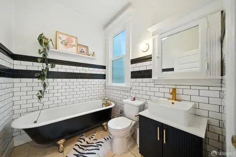 a living room with furniture fireplace and flat screen tv