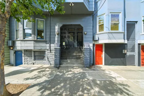 a view of staircase with white walls and a window