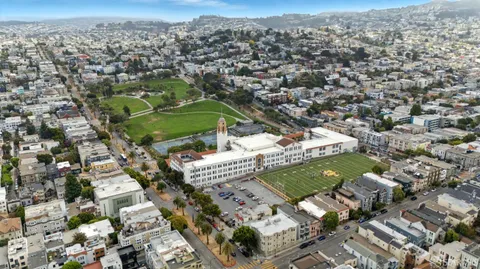a view of a street with stores