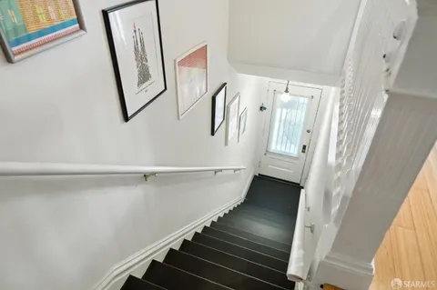 a view of a hallway view with wooden floor