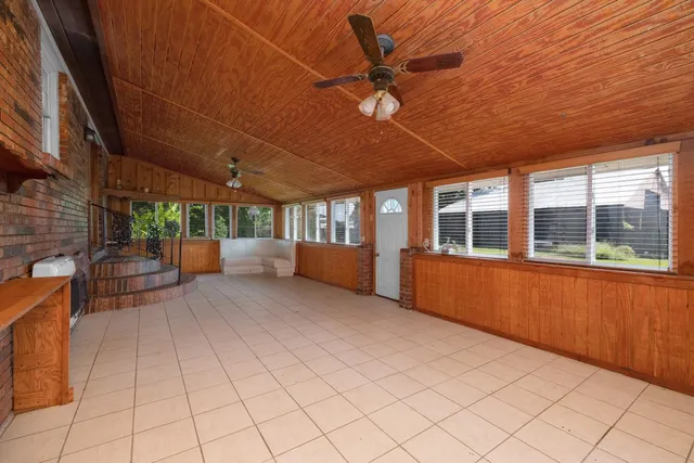 a view of a house with backyard patio and swimming pool