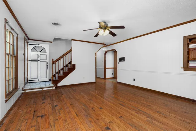 a view of an entryway with wooden floor