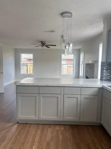 a bathroom with a sink granite and a vanity