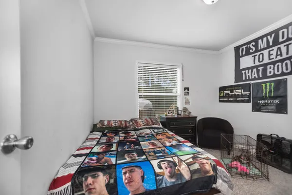 a bedroom with a workspace