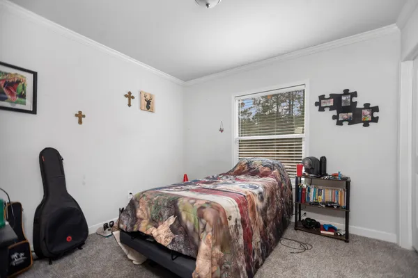 a bedroom with a bed and a table in it