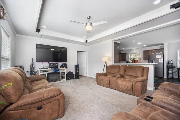 a living room with furniture and a fireplace