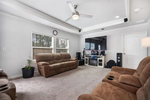 a living room with furniture and a window