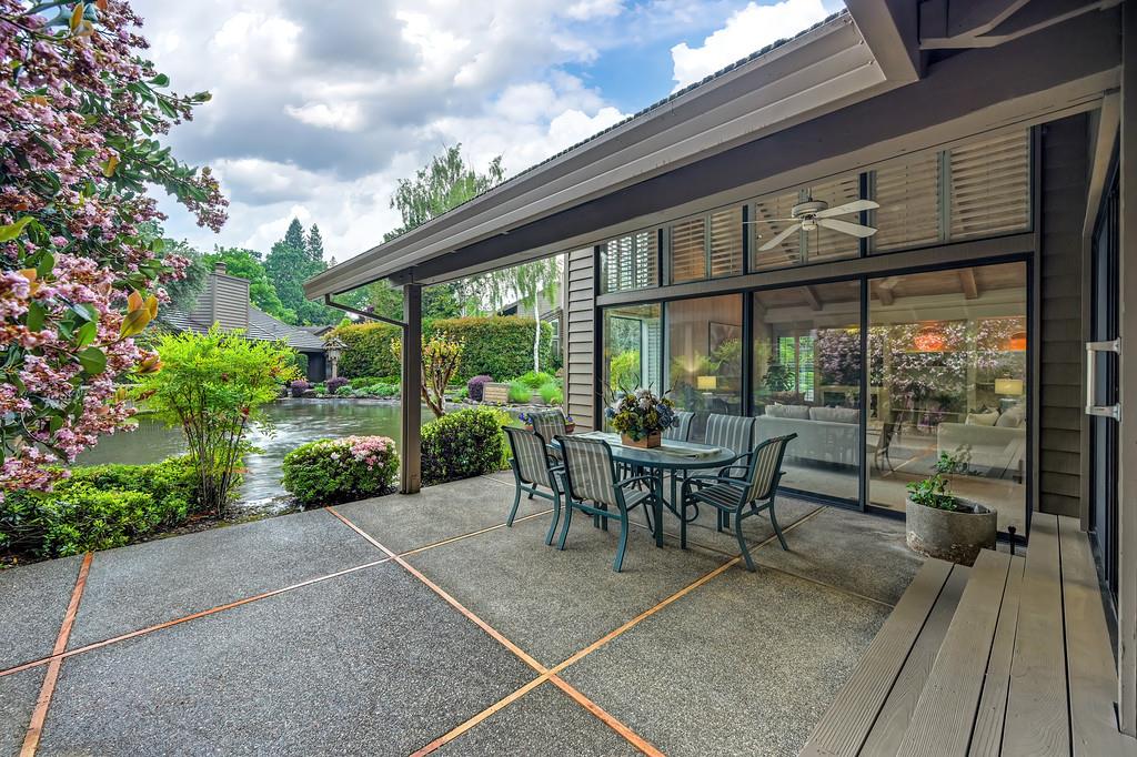 7650 Pineridge Road Fair Oaks, CA 95628 - Photo 38 of 67 a view of a patio with table and chairs potted plants with floor to ceiling window